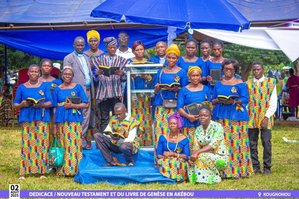 A group gathers at the Akebu New Testament dedication.